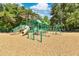 Community playground with slides, climbing structures, and a covered play area in a wooded setting at 2460 Worthington Rd, Maitland, FL 32751