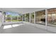 Bright screened porch leading to outdoor deck, perfect for entertaining or relaxing outdoors at 2460 Worthington Rd, Maitland, FL 32751