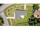 An aerial view of a home featuring a large backyard, a patio, and a driveway at 2471 Greenwood St, Deltona, FL 32738