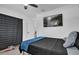 Cozy bedroom features a ceiling fan, wall-mounted television, and a large, comfortable bed at 2471 Greenwood St, Deltona, FL 32738