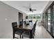Dining room featuring modern furniture, bright natural light, and access to the outdoor patio at 2471 Greenwood St, Deltona, FL 32738