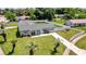 Charming home with a spacious lawn, a swing set, and a white picket fence at 2471 Greenwood St, Deltona, FL 32738