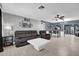 This living room features tile floors, gray paint, modern furniture, and recessed lighting at 2471 Greenwood St, Deltona, FL 32738