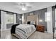 This spacious main bedroom features modern lighting, neutral colors, and a ceiling fan at 2471 Greenwood St, Deltona, FL 32738