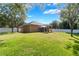 This backyard features a large grassy area, white privacy fence, and gazebo at 2619 Breezy Meadow Rd, Apopka, FL 32712