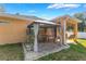 The backyard has a cozy patio with a swing, grill, and a covered gazebo with a ping pong table at 2619 Breezy Meadow Rd, Apopka, FL 32712