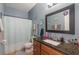 This bathroom has tile floors, toilet, vanity with sink, and a shower and tub at 2619 Breezy Meadow Rd, Apopka, FL 32712