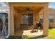 Inviting covered patio boasts a ceiling fan, swing, grill, and easy access to outdoor entertaining space at 2619 Breezy Meadow Rd, Apopka, FL 32712