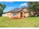 Beautiful exterior view of home with tidy lawn and landscaping highlighting the architecture at 2619 Breezy Meadow Rd, Apopka, FL 32712