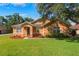 Charming single-story home featuring well-manicured lawn, mulch beds, and a welcoming front entrance at 2619 Breezy Meadow Rd, Apopka, FL 32712