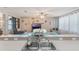 Bright kitchen with stainless steel sink overlooking an open concept living area at 2619 Breezy Meadow Rd, Apopka, FL 32712