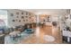 Open-concept interior showcasing tile floors, neutral walls and a cozy seating arrangement at 2619 Breezy Meadow Rd, Apopka, FL 32712