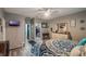 This main bedroom has wood floors, walk-in closet, TV, and a vanity with drawers at 2619 Breezy Meadow Rd, Apopka, FL 32712