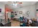 Spacious office with ceiling fan, tiled floors, multiple desks, and ample storage and decor at 2619 Breezy Meadow Rd, Apopka, FL 32712