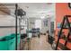 Bright office with multiple computer setup, tiled floors, shelving, and natural light at 2619 Breezy Meadow Rd, Apopka, FL 32712