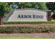 Community sign for Arbor Ridge with manicured landscaping at 2619 Breezy Meadow Rd, Apopka, FL 32712