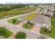 Inviting townhomes featuring a brick driveway and manicured lawns in a well-maintained community at 3007 Caneel St, Winter Haven, FL 33884