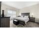 Spacious bedroom features a large bed with plush bedding, soft carpet, and plenty of natural light from the window at 3007 Caneel St, Winter Haven, FL 33884