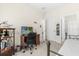 Comfortable bedroom featuring a wooden desk, chair, and a decorative display shelf at 3007 Caneel St, Winter Haven, FL 33884