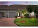 Charming single-story home with a well-maintained lawn, inviting front entrance, and two-car garage at 3007 Caneel St, Winter Haven, FL 33884