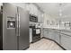 Modern kitchen featuring stainless steel appliances, gray cabinets, and ample counter space at 3007 Caneel St, Winter Haven, FL 33884
