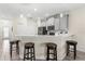Beautiful kitchen island featuring grey cabinets, pendant lighting, and bar stool seating at 3007 Caneel St, Winter Haven, FL 33884