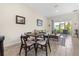 Comfortable living room area open to dining with sliding doors to lanai, modern furnishings, and tile floors at 3007 Caneel St, Winter Haven, FL 33884