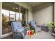 Relaxing screened patio with cushioned seating, a small table, and a glimpse of the home's interior at 3007 Caneel St, Winter Haven, FL 33884