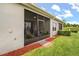The screened patio offers a tranquil outdoor space, surrounded by lush landscaping and a well-maintained lawn at 3007 Caneel St, Winter Haven, FL 33884