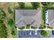 Overhead view of the townhome's roof, with designated parking and well-maintained green spaces at 316 Primrose Dr, Davenport, FL 33837