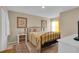 Inviting bedroom with a metal frame bed and soft, warm-toned bedding at 316 Primrose Dr, Davenport, FL 33837