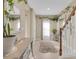 Inviting foyer boasts neutral walls, tiled floors, a soft rug, a staircase, and decor that enhance the ambiance at 316 Primrose Dr, Davenport, FL 33837