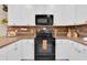 Well-equipped kitchen with modern appliances, white cabinetry, and stylish decor for a functional and inviting space at 316 Primrose Dr, Davenport, FL 33837