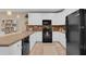 Spacious kitchen featuring white cabinets, modern appliances, and a stylish backsplash, perfect for culinary enthusiasts at 316 Primrose Dr, Davenport, FL 33837