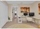 Well-lit office area with ample desk space and a view of the hallway at 316 Primrose Dr, Davenport, FL 33837