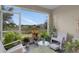Relaxing screened porch with a view of the landscape and comfortable seating at 316 Primrose Dr, Davenport, FL 33837