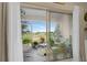 Relaxing screened porch with a view of the landscape and comfortable seating at 316 Primrose Dr, Davenport, FL 33837