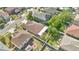 View of the home from above showing a fenced backyard with mature landscaping and privacy at 321 Thomasdale Ave, Haines City, FL 33844