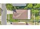An overhead view of the house's roof, backyard and well-manicured lawn at 321 Thomasdale Ave, Haines City, FL 33844