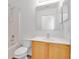Bathroom with modern white vanity, shower, and tub at 321 Thomasdale Ave, Haines City, FL 33844