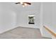 Bright bedroom with hardwood tile floor, window, and ceiling fan at 321 Thomasdale Ave, Haines City, FL 33844