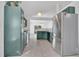 Well-lit kitchen features stainless steel appliances and modern green cabinetry at 321 Thomasdale Ave, Haines City, FL 33844