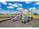 Community playground featuring a slide, stairs, and climbing structure at 321 Thomasdale Ave, Haines City, FL 33844