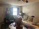 Cozy living room with couch, ceiling fan, neutral color palette, and a window providing natural light at 3347 Timberline W Rd, Winter Haven, FL 33880