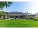 Lush backyard with a screened-in pool area, perfect for outdoor relaxation and enjoyment at 341 Sprucewood Rd, Lake Mary, FL 32746
