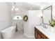 Bathroom featuring double vanity with dark wood cabinets, marble tiling, and freestanding tub at 341 Sprucewood Rd, Lake Mary, FL 32746