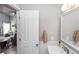 Bright bathroom featuring a white sink, decorative mirror, and neutral wall colors at 341 Sprucewood Rd, Lake Mary, FL 32746