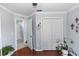 Bedroom features white closet doors, warm hardwood floors, and modern trimwork at 341 Sprucewood Rd, Lake Mary, FL 32746
