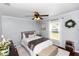 Charming bedroom with a ceiling fan, natural light, and a comfortable bed at 341 Sprucewood Rd, Lake Mary, FL 32746