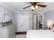 Comfortable bedroom featuring light-colored walls, ceiling fan, and a spacious closet at 341 Sprucewood Rd, Lake Mary, FL 32746